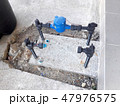 Water pipe and meter with waterspout on the floor. 47976575