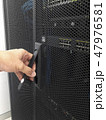 Man open the door of computer server rack 47976581