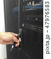 Man open the door of computer server rack 47976583