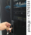 Man open the door of computer server rack 47976584