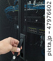 Man open the door of computer server rack 47976602