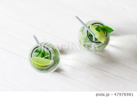 Glass jars with Mojito cocktail Glass jars with Mojito cocktail 47976981
