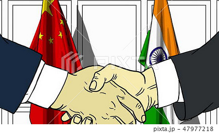 Businessmen or politicians shaking hands against flags of China and India. Meeting or cooperation Businessmen or politicians shaking hands against flags of China and India. Meeting or cooperation 47977218