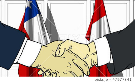 Businessmen or politicians shake hands against flags of Chile and Peru. Official meeting or 47977341