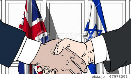 Businessmen or politicians shake hands against flags of Britain and Israel. Official meeting or Businessmen or politicians shake hands against flags of Britain and Israel. Official meeting or 47978091