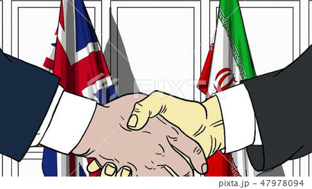 Businessmen or politicians shake hands against flags of Britain and Iran. Official meeting or Businessmen or politicians shake hands against flags of Britain and Iran. Official meeting or 47978094