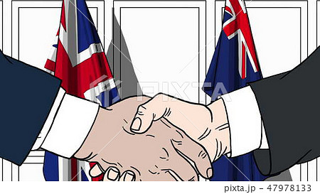 Businessmen or politicians shaking hands against flags of Great Britain and Australia. Meeting or Businessmen or politicians shaking hands against flags of Great Britain and Australia. Meeting or 47978133