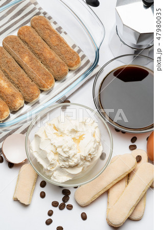 Ingredients for making traditional italian cake tiramisu on white background Ingredients for making traditional italian cake tiramisu on white background 47980035