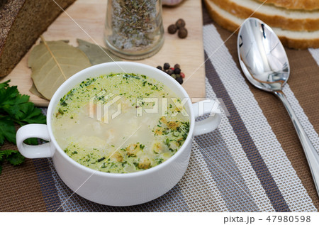 Mushroom soup with croutons in a white dish. 47980598