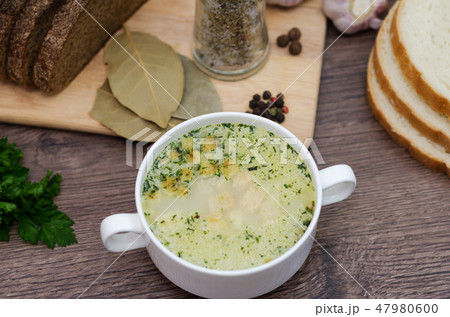 Mushroom soup with croutons in a white dish. 47980600