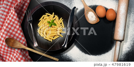 Traditional Italian Pasta - Raw food called Penne Traditional Italian Pasta - Raw food called Penne 47981619