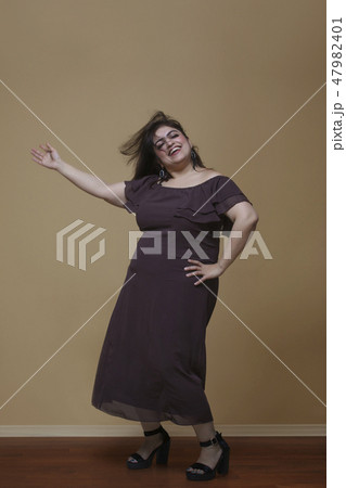 Fat woman dancing on high heels Fat woman dancing on high heels 47982401