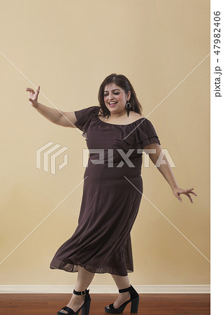 Fat woman dancing on high heels Fat woman dancing on high heels 47982406