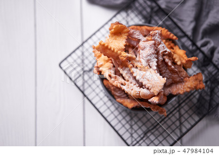 Brushwood - russian traditional cookies with powdered sugar. Food consept. Plate with hvorost on Brushwood - russian traditional cookies with powdered sugar. Food consept. Plate with hvorost on 47984104