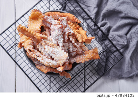 Brushwood - russian traditional cookies with powdered sugar. Food consept. Plate with hvorost on Brushwood - russian traditional cookies with powdered sugar. Food consept. Plate with hvorost on 47984105