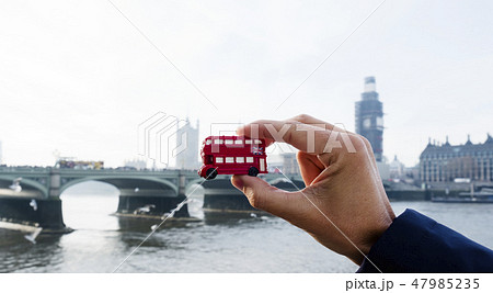 man with a londoner red double-decker bus 47985235