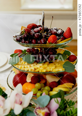 Fruit plate on the table of the newlyweds. Wedding decoration Fruit plate on the table of the newlyweds. Wedding decoration 47985592