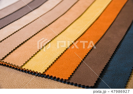Colorful and bright fabric samples of leatherette furniture and clothing upholstery. Close-up of a Colorful and bright fabric samples of leatherette furniture and clothing upholstery. Close-up of a 47986927