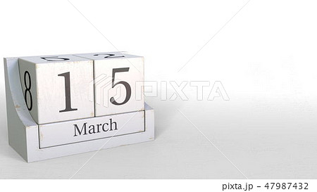 Wood cube calendar shows March 15 date, 3D rendering 47987432