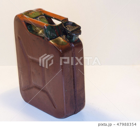 old metal canister with fuel on a light background old metal canister with fuel on a light background 47988354