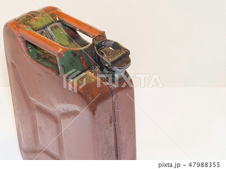old metal canister with fuel on a light background 47988355