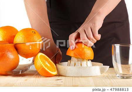 girl preparing fresh citrus juice girl preparing fresh citrus juice 47988813