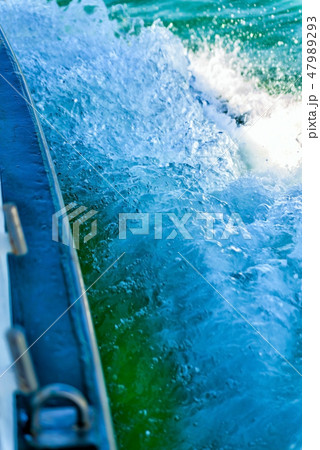 Water spray from boat racing Water spray from boat racing 47989293