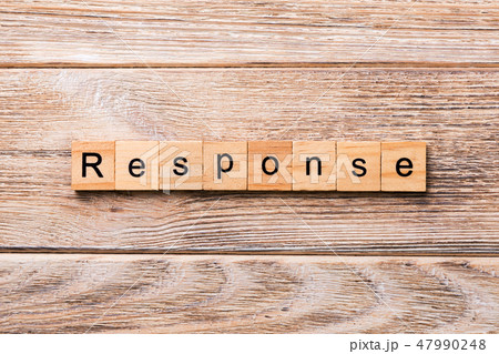 RESPONSE word written on wood block.  47990248