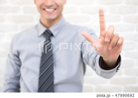 Businessman hand touching empty virtual screen Businessman hand touching empty virtual screen 47990692
