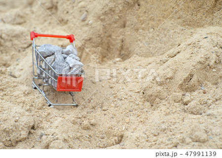 Shopping trolley stand on the pile of sand Shopping trolley stand on the pile of sand 47991139