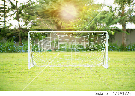 Selective focus on a small soccer goal with net 47991726