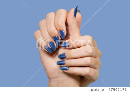 hands with blue glossy professional manicure hands with blue glossy professional manicure 47992171