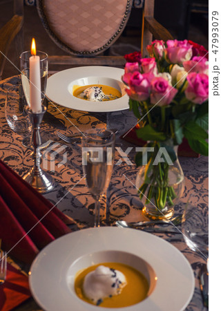 carrot and chestnut creamy soup in restaurant 47993079