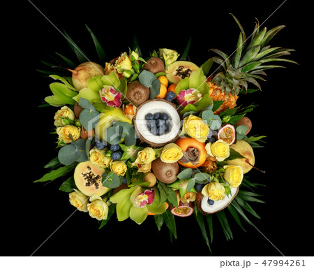 Wooden box with lots of exotic fruits and flowers Wooden box with lots of exotic fruits and flowers 47994261