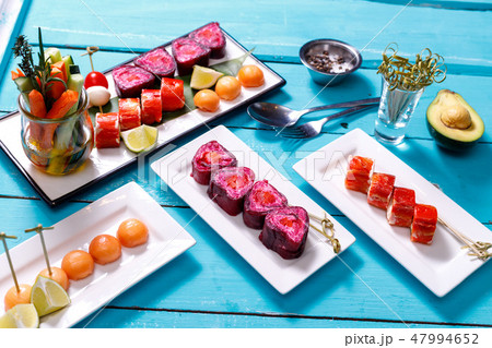 snacks on blue wooden background snacks on blue wooden background 47994652