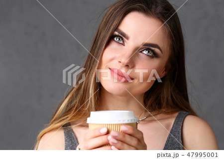 Beautiful young smiling woman hold in arms 47995001