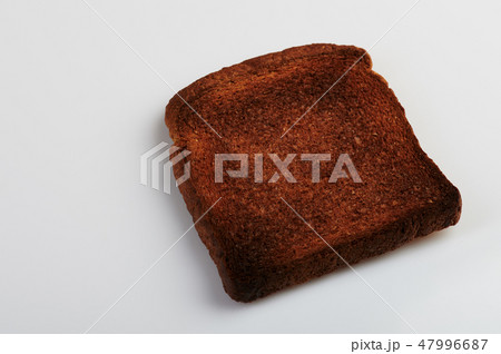 Piece of burnt bread 47996687