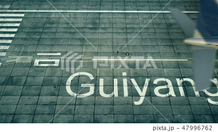 Aerial view of an airplane arriving to Guiyang airport. Travel to China 3D rendering 47996762