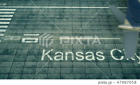 Aerial view of an airplane arriving to Kansas City airport. Travel to the United States 3D rendering Aerial view of an airplane arriving to Kansas City airport. Travel to the United States 3D rendering 47997058