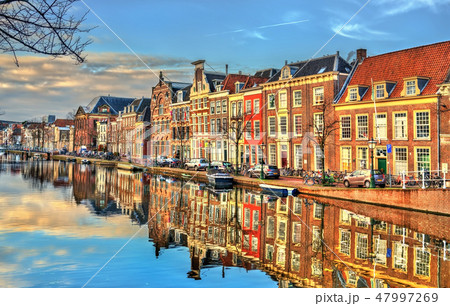 Traditional houses beside a canal in Leiden, the Netherlands 47997269
