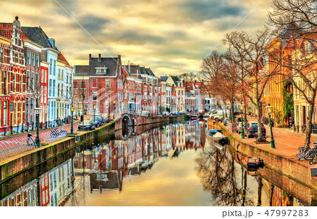 Traditional houses beside a canal in Leiden, the Netherlands 47997283