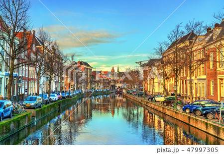 Traditional houses beside a canal in Leiden, the Netherlands 47997305