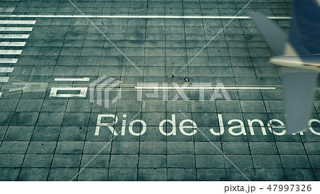 Aerial view of an airplane arriving to Rio de Janeiro airport. Travel to Brazil 3D rendering Aerial view of an airplane arriving to Rio de Janeiro airport. Travel to Brazil 3D rendering 47997326