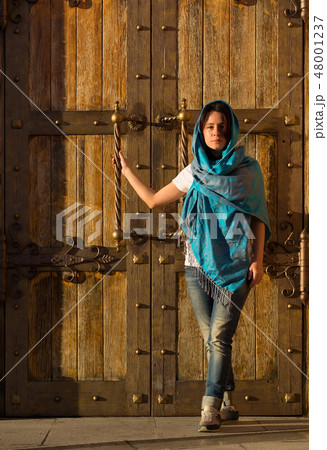 A girl in a Church handkerchief and jeans 48001237