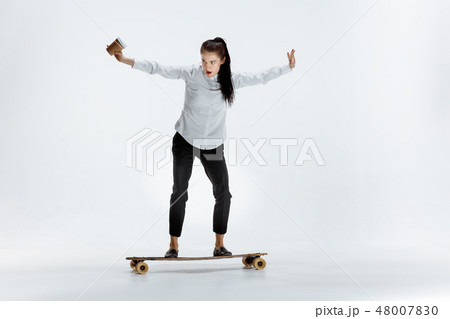 businesswoman riding skate on white background 48007830