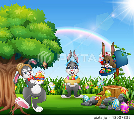 Easter bunnies and colorful egg on the garden Easter bunnies and colorful egg on the garden 48007885