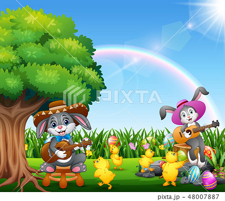 Cute bunnies relax playing guitar and chick 48007887