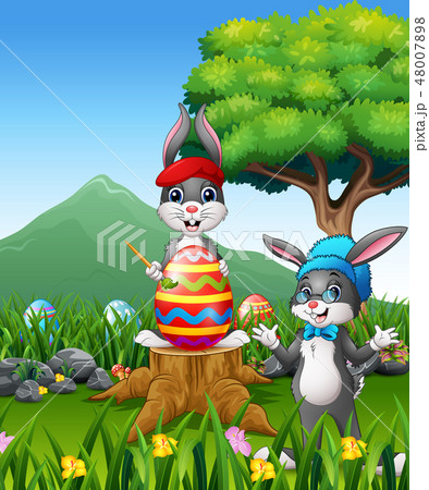 Easter backround with bunnies and big easter egg Easter backround with bunnies and big easter egg 48007898