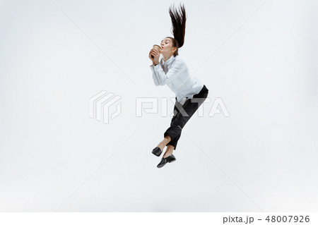Happy business woman dancing and smiling isolated on white. 48007926