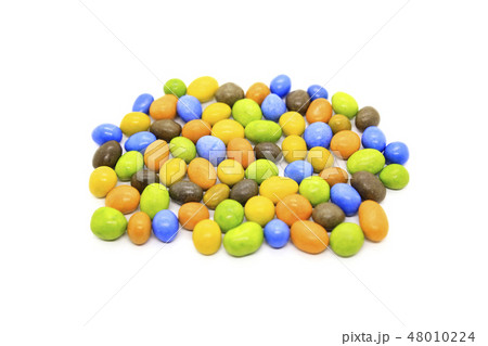 Bright multicolored glazed candies on white 48010224